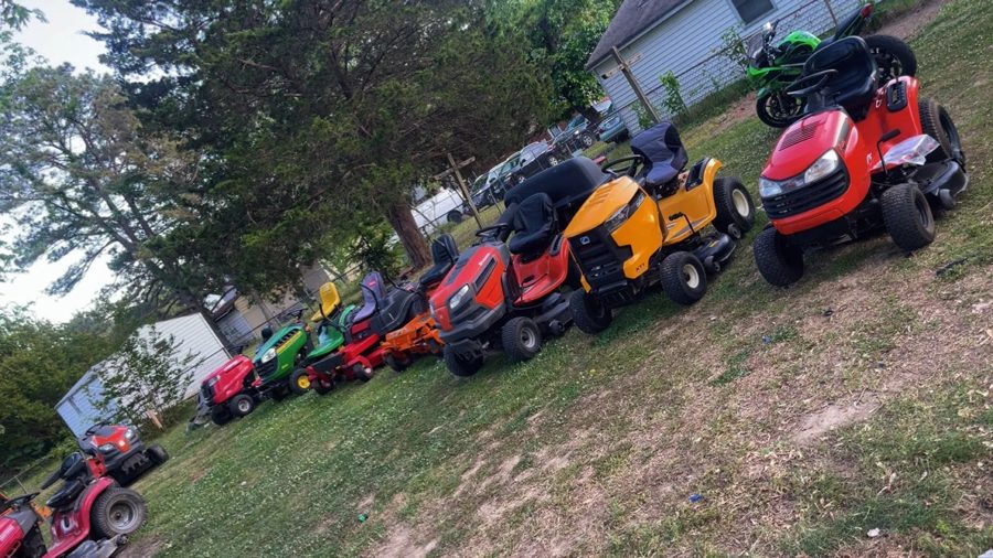 Row of riding mowers lined up for tune-ups and repairs